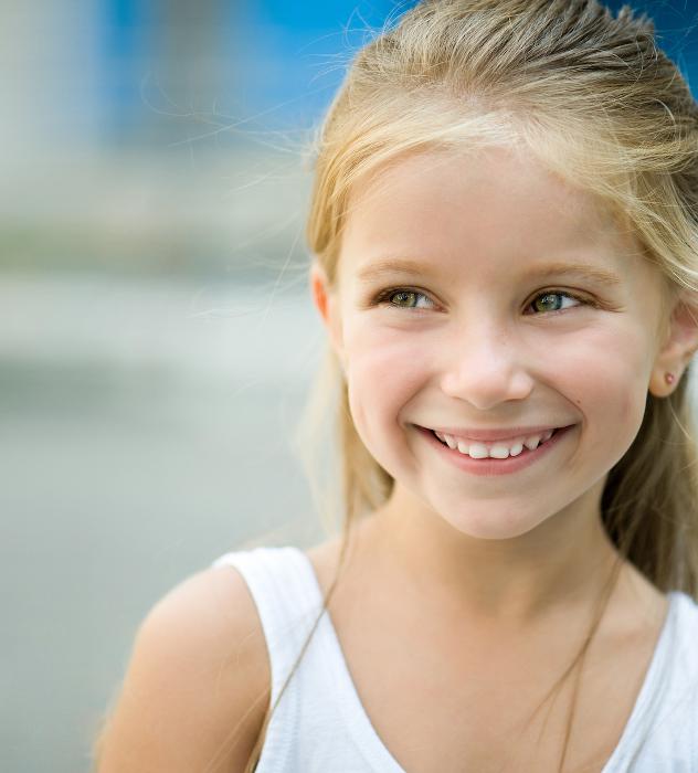 A smiling child outside
