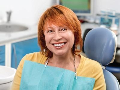 woman wearing dentures in jensen beach fl