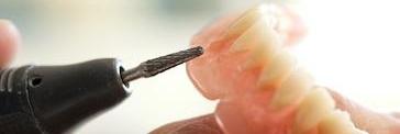 dentist working on dentures in jensen beach fl