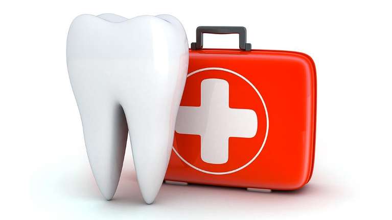A close-up of a tooth with a first aid box placed next to it